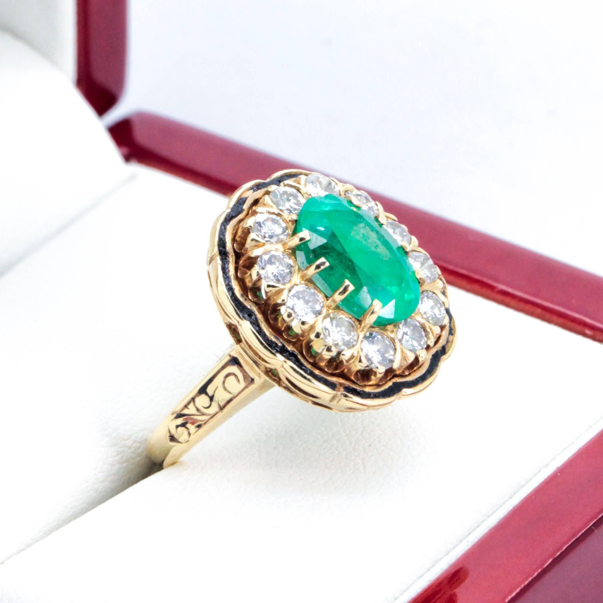 Vintage Emerald and Diamond cluster Cocktail ring with Enamel detail and 12 Diamonds.  

Great ring for either hand this 14ct yellow gold 13 stone Emerald and Diamond cluster ring features an old cut, oval Emerald 8 claw set surrounded by 12 round