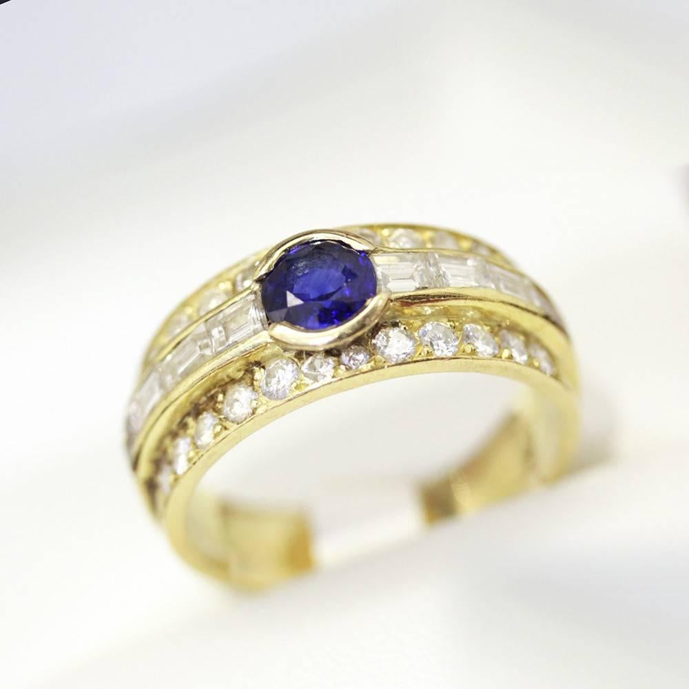 French Royal Blue Sapphire ring band with Diamonds, 18ct gold, fabulous easy to wear. 

One 18ct yellow gold ladies cast ring (French Hallmark) featuring one round brilliant-cut royal blue sapphire of fine colour and clarity with an estimated weight