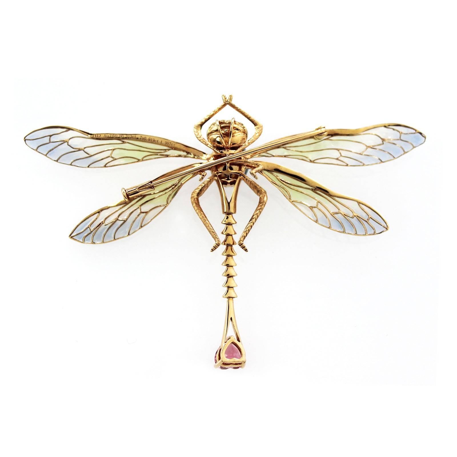 A beautiful large dragonfly brooch, which also can be worn as a pendant. Made in 18k gold, set with multi gems, garnet body, tourmaline tail, and diamonds all around. Wings made by transparent enamel. 

Lots of details on the pieces front as well