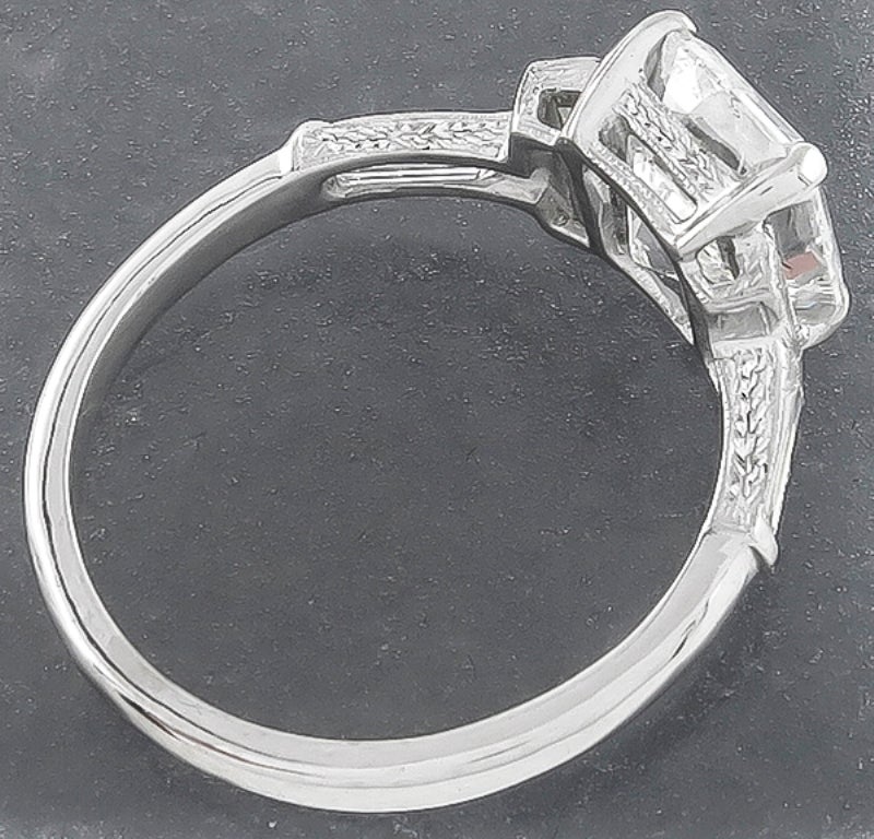 This elegant platinum ring centers a sparkling GIA certified emerald cut diamond that weighs 2.18ct. and is graded F color with SI2 clarity. The center diamond is accentuated by dazzling baguette cut diamonds weighing approximately 0.40ct.
The ring