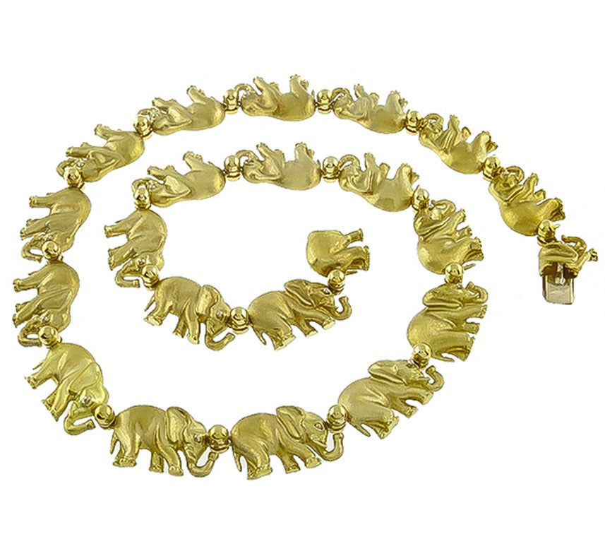 This is an elegant 18k yellow gold necklace by Roberto Coin. The necklace features gorgeous elephant motif. The necklace measures 12mm in width and 17 1/4 inches in length. The necklace is stamped with manufacturer's hallmark 750 and is numbered.