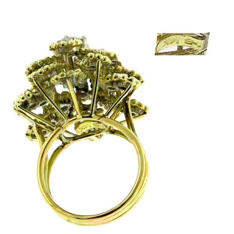 Made of 14k yellow gold, this ring centers a round cut diamond weighing approximately 0.85ct. graded H-I color with VS1 clarity. Accentuating the center stone are small round cut diamonds weighing approximately 1.25ct. graded F color with VS