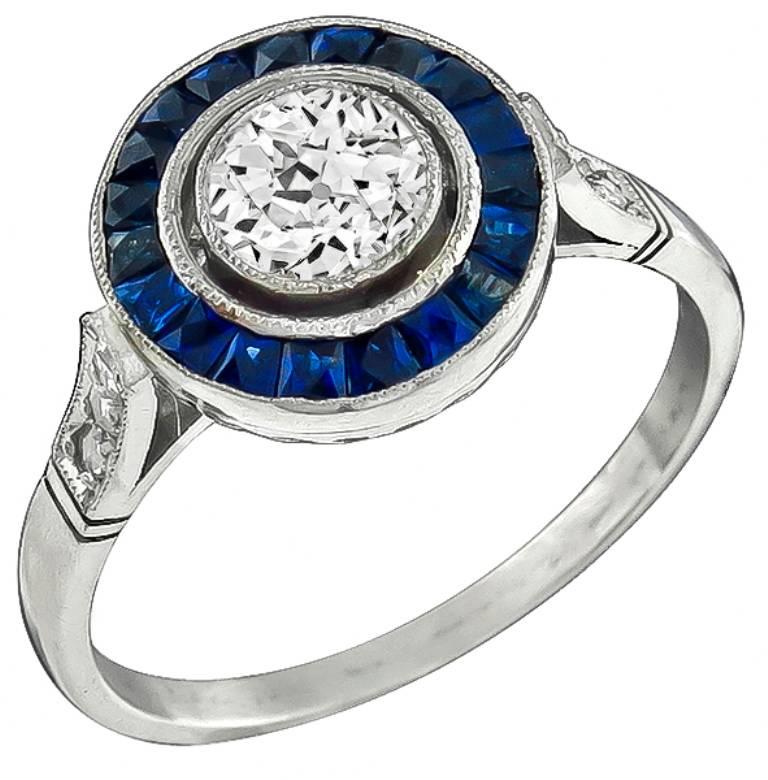 0.62 Carat GIA Cert Diamond Sapphire Halo Platinum Engagement Ring For Sale