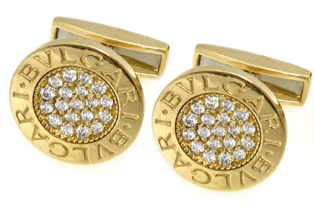 Made of 18k yellow gold, these cufflinks feature sparkling round cut diamonds that weigh approximately 1.15ct. graded E color with VVS clarity. 
The cufflinks measure 15mm in diameter and weighs 13.2 grams.

Each of the cufflinks is triple signed