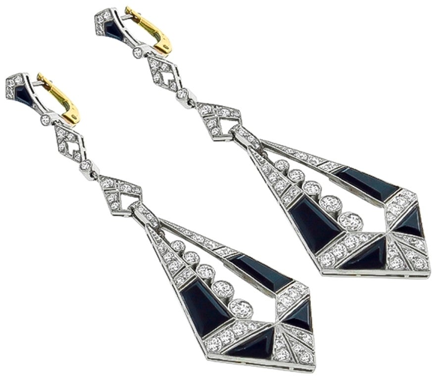 This beautiful pair of platinum earrings feature wonderful geometric cut onyx. which are accentuated with sparkling old mine cut diamonds that weighs approximately 2.50ct. The color of these diamonds is F-G with VS1 clarity. 

Inventory #4555WRSS