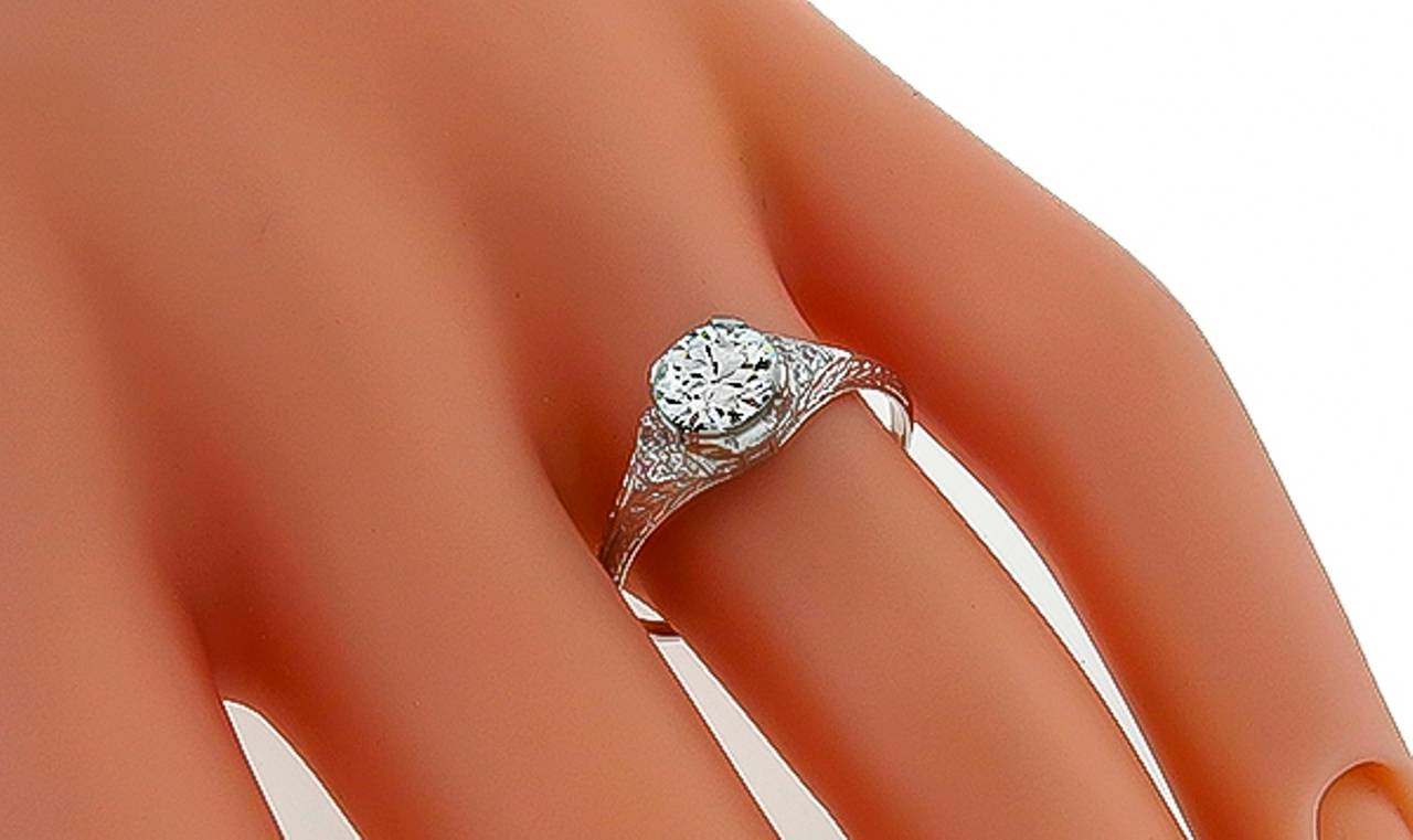 This platinum ring from the Edwardian era is centered with a sparkling GIA certified old mine cut diamond that weighs 0.78ct. and is graded H color with VS1 clarity. The ring is size 6 3/4, and can be resized. 

Inventory #89188ABSS