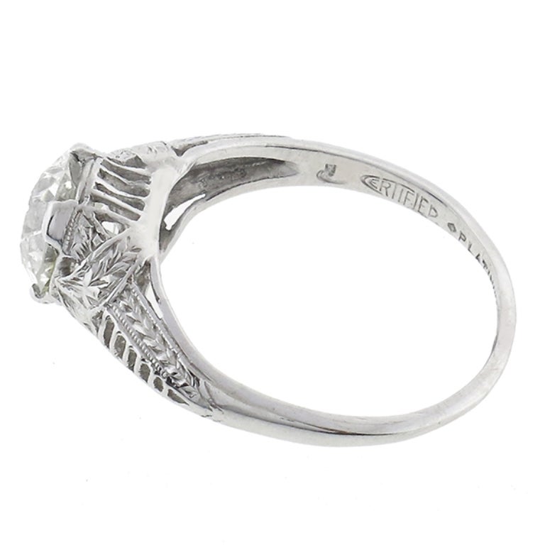 This elegant platinum ring from the Edwardian era, centers a sparkling GIA certified old European cut diamond that weighs 1.27ct. The color of the diamond is K with SI1 clarity. The ring has amazing open work design and is stamped PLATINUM.

The