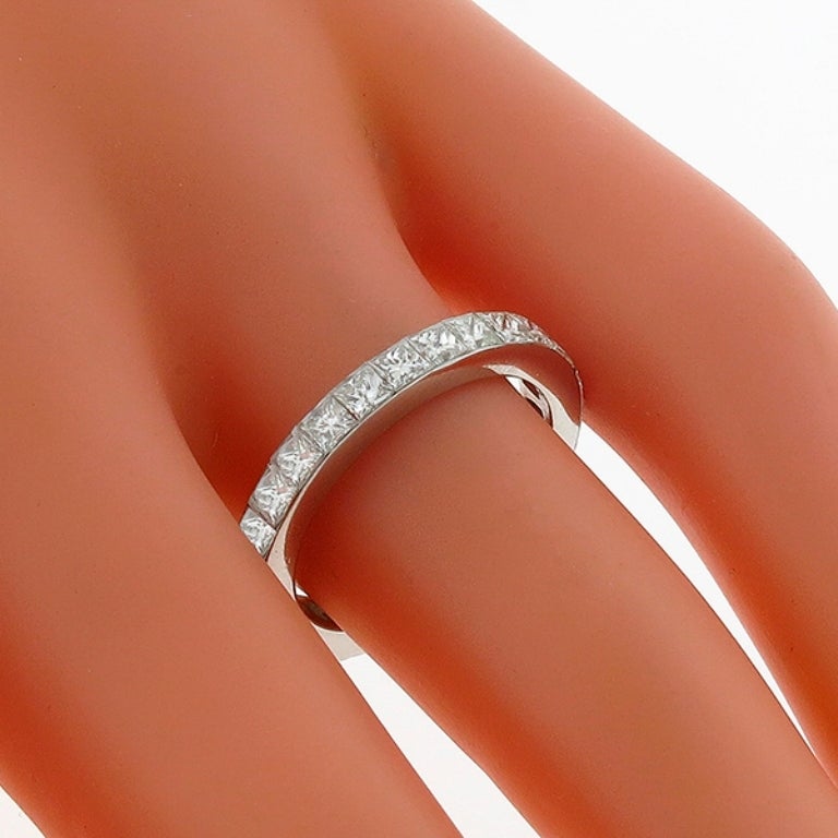 This beautiful platinum wedding band is set with sparkling princess cut diamonds weighing approximately 2.25ct. The color of the diamonds is F with VS clarity. The width of the band is 3mm, and it's is size 5 1/2.

Inventory #4273PKSS