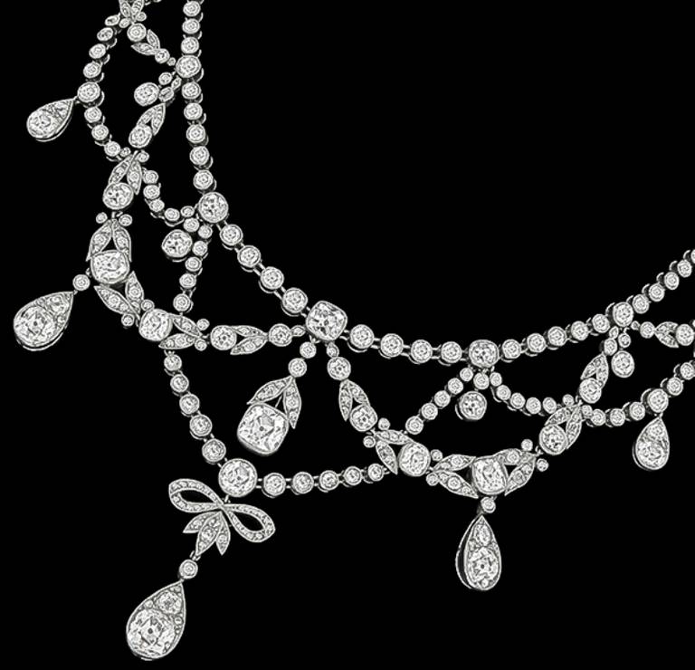 This elegant platinum necklace is set with sparkling old mine cut diamonds weighing approximately 18.00 carat and is graded F-G color with VS clarity.
The necklace is stamped with original French hallmarks.

Inventory #38764WRSSS