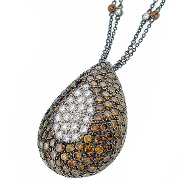 This beautiful 14k oxidized gold diamond necklace features sparkling round cut fancy brown to orange color diamonds weighing approximately 5.00ct and bright white round cut diamonds weighing approximately 0.70ct. The color of the diamonds is G with