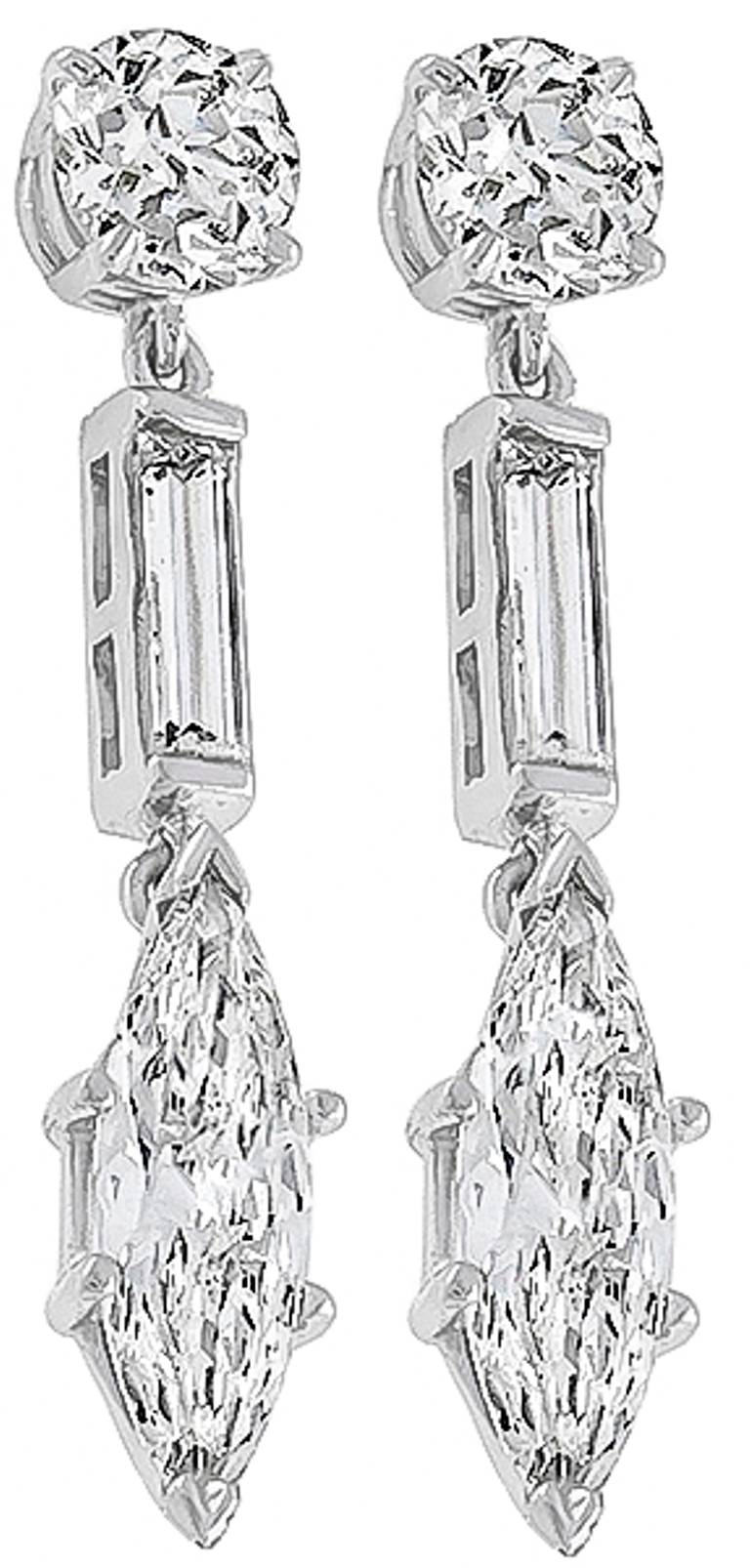 This elegant pair of earrings are set with round, baguette, and marquise cut diamonds weighing approximately 4.90 carat. The color of these diamonds are H-J with VS clarity.

Inventory #71017KWSS
