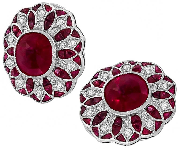 Made of 18k white gold, these earrings feature bright red rubies weighing approximately 5.00 carat. The rubies are accentuated by sparkling round cut diamonds weighing approximately 0.40ct.

Inventory #69466PKSS