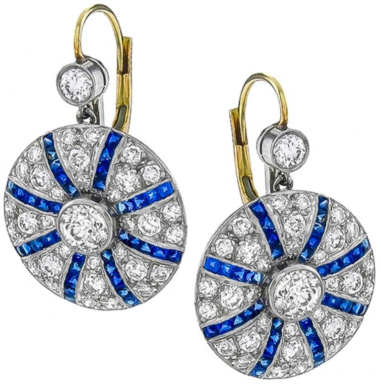 Inspired from the Art Deco era, this magnificent pairof earrings features french cut sapphires weighing approximately 2 carats and round cut diamonds weighing approximately 2.90ct.

Inventory #5023AABS