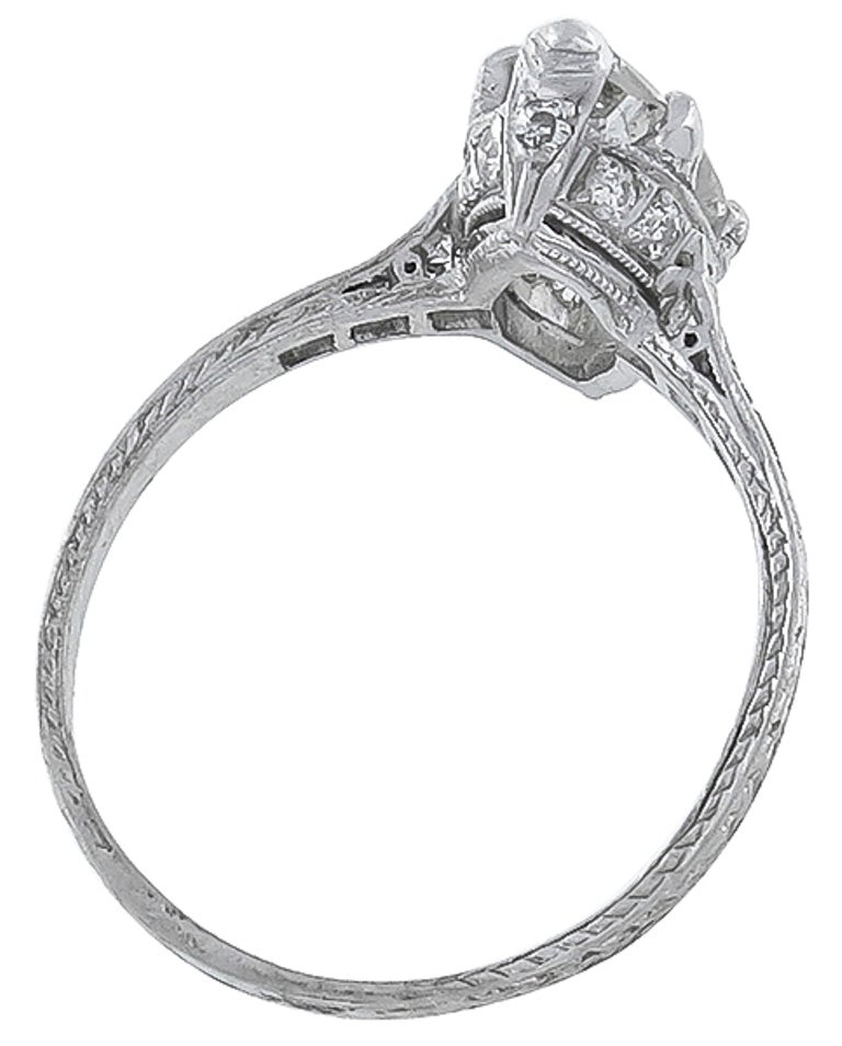 This platinum ring centers a sparkling GIA certified marquise cut diamond that weighs 1.40ct. and is graded G color with SI1 clarity. The mounting is enhanced by sparkling round cut diamonds weighing approximately 0.40ct.
The size of the ring is 5