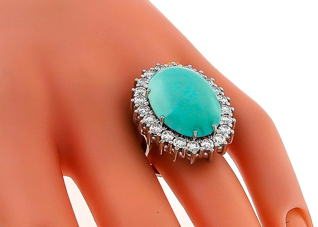 Made of 18k white gold, this ring and earrings set feature cabochon turquoise which are accentuated by round cut diamonds weighing approximately 7.00ct. The color of the diamonds is F with VS clarity.
The ring is size 7 1/4, and can be