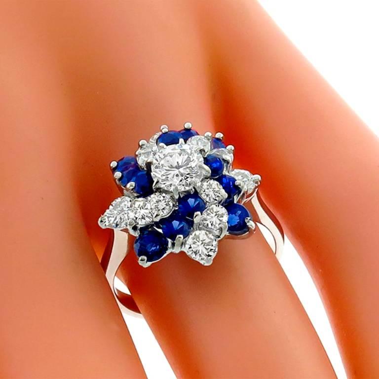 This magnificent ring is set by round cut sapphires weighing approximately 0.50ct. and sparkling round cut diamonds weighing approximately 0.80ct. graded F color with SI clarity.
The size of the ring is 6 1/4, and can be resized. 

Inventory