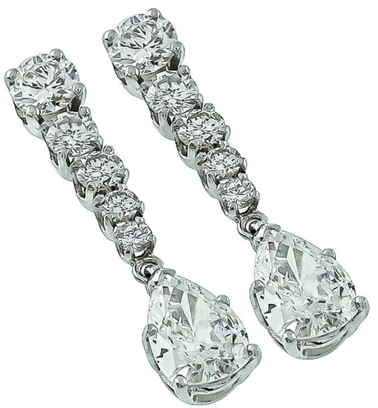 Made of of 18k white gold, these earrings feature sparkling pear and round cut diamonds that weigh approximately 2.70ct. and are graded F-G color with VS clarity. The earrings measure 26mm by 5mm and weigh 3.8 grams.

Inventory# 16632WBSS