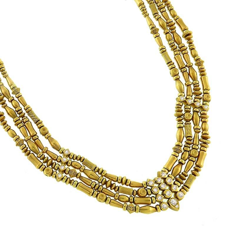 This fabulous 18k yellow gold bead chain necklace by Seidengang, features an elegant 4 rows of varieties of sequence gold beads. The beads are accentuated by sparkling round cut diamonds that weigh approximately 2.40ct. graded F color with VS
