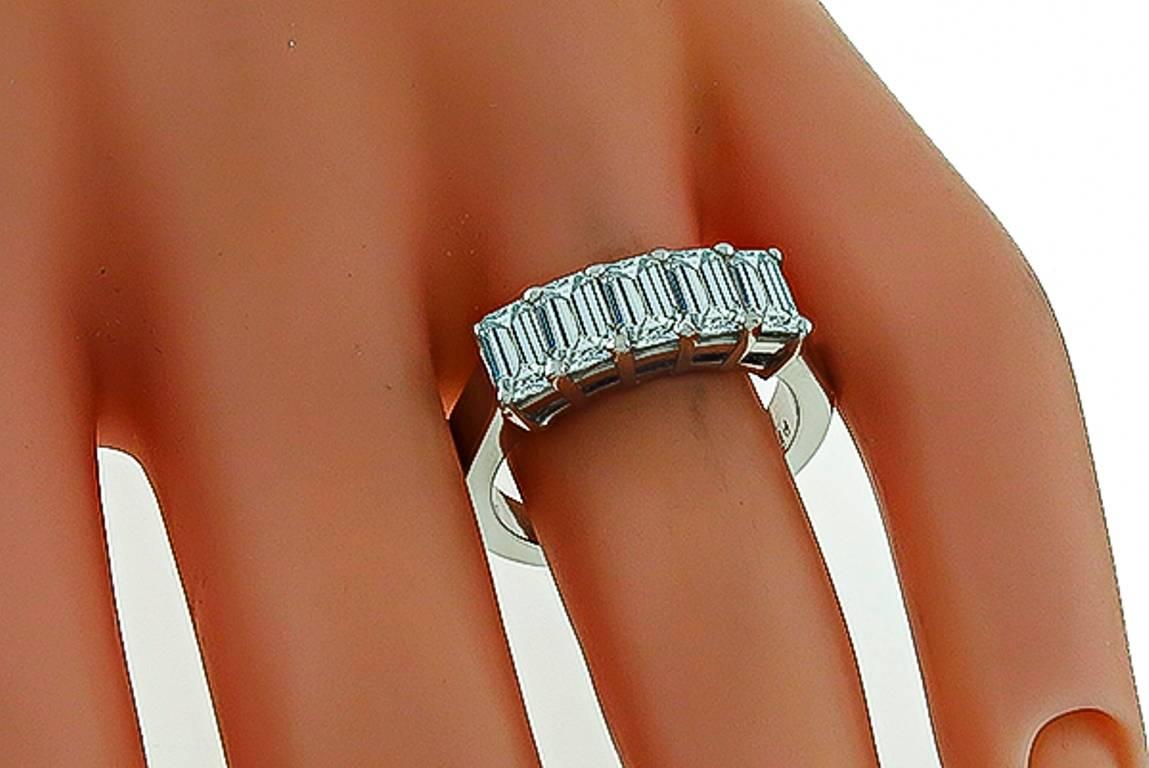 This elegant platinum ring is set with sparkling emerald cut diamonds weighing approximately 2.00ct. graded E-F color with VS1 clarity. The top of the ring measures 6mm by 17mm.
It is currently size 7 1/4, and can be resized.

Inventory #66379AWBS