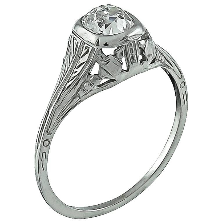 This beautiful 18k white gold ring is centered with a sparkling GIA certified old European cut diamond that weighs 0.54ct. and is graded I color with VS2 clarity. The ring is stamped 18k and weighs 1.6 gram. It is currently size 5 1/2, and can be