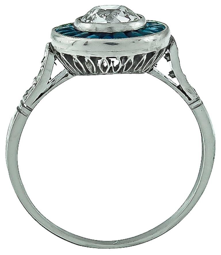 Art Deco Charming 0.70 Carat GIA Certified Diamond Sapphire Platinum Halo Engagement Ring For Sale