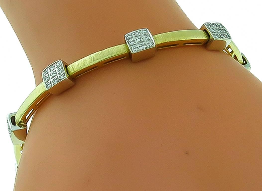 This elegant 18k yellow and white gold bracelet by Craig Drake, is set with sparkling round cut diamonds weighing approximately 2.00ct. graded G color with VS clarity. The bracelet measures 6mm in width and 7 1/2 inches in length.
It is stamped