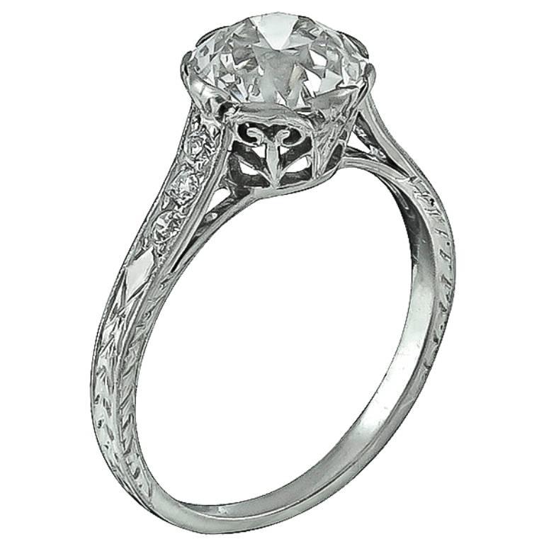 This fabulous platinum engagement ring from the Edwardian era centers with a sparkling GIA certified old European cut diamond that weighs 2.01ct. graded I color with VVS2 clarity. Accentuating the center stone are dazzling round cut diamond accents.