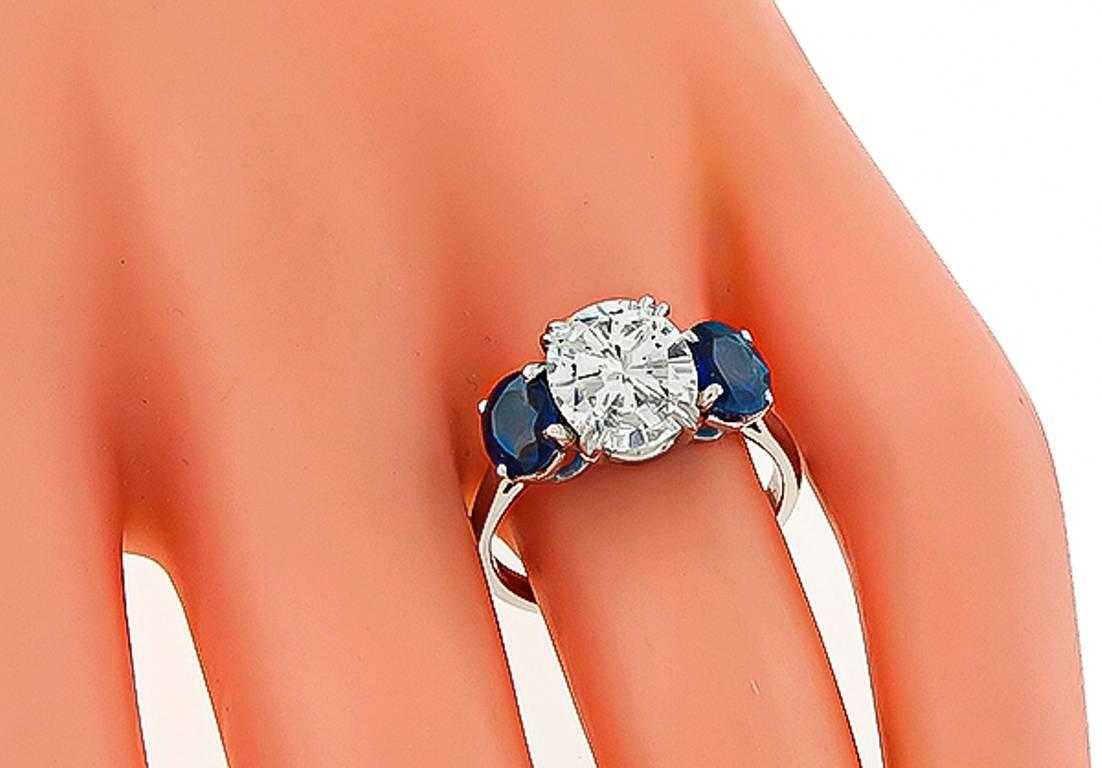 2.12 Carat Oval Cut Diamond Sapphire Platinum Engagement Ring In Excellent Condition In New York, NY