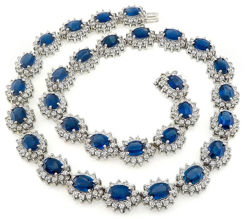 This fabulous 18k white gold necklace is set with oval cut sapphires that weigh approximately 52.50ct. Accentuating the sapphires are sparkling round cut diamonds that weigh approximately 15.00ct.  graded G-H color with VS clarity. The necklace