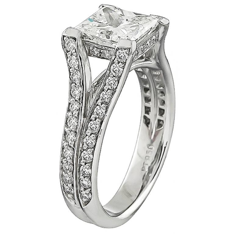 This stunning platinum ring is centered with a sparkling GIA certified princess cut diamond that weighs 2.06ct. graded H color with VS2 clarity. Accentuating the center stone are dazzling round cut diamonds that weigh approximately 0.50ct. graded H