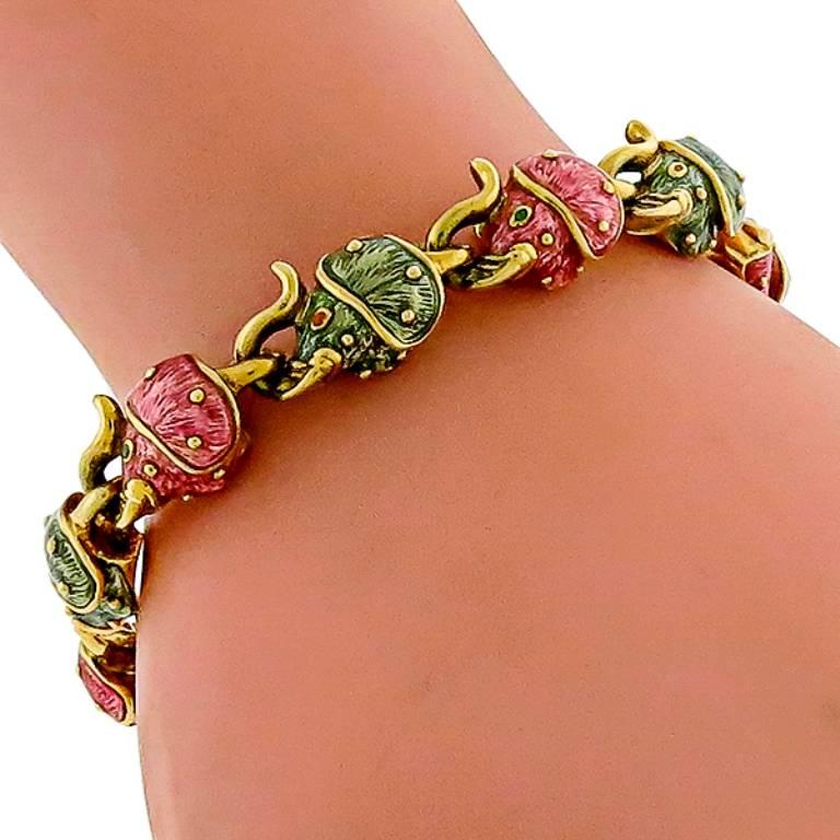 This gorgeous 18k yellow gold enamel elephant bracelet by Hidalgo, features green and pink enamel inlay elephant link charms.The bracelet measures 7 1/2 inches in length, 12mm in width and weighs 60 grams.
It is signed HIDALGO 94 750.

Inventory