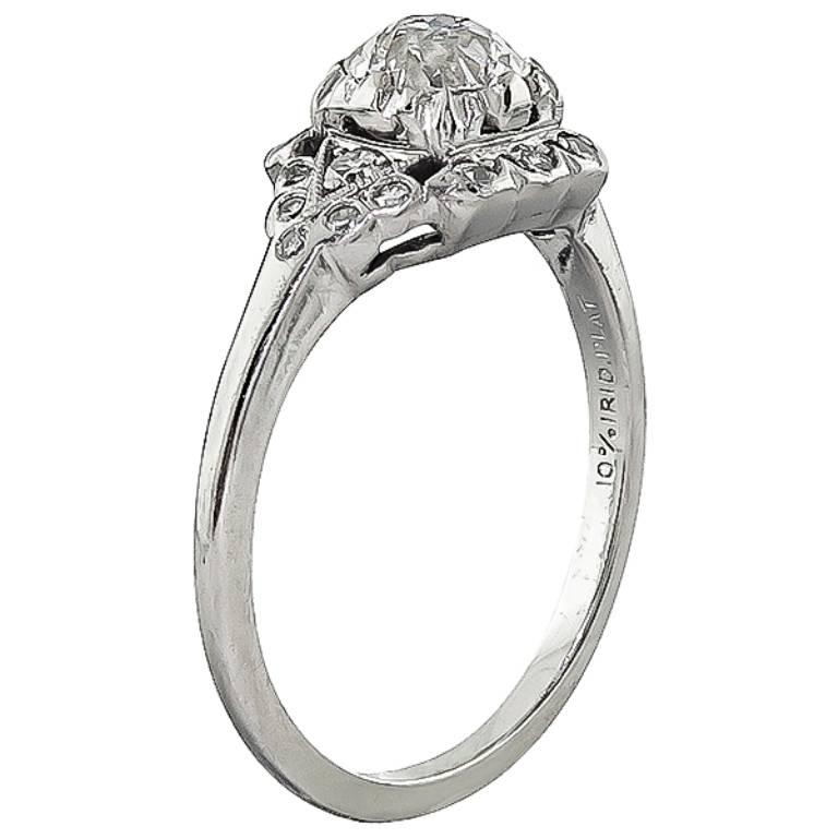 This beautiful platinum engagement ring from the Art Deco era,  is centered with a sparkling GIA certified old European cut diamond that weighs 0.68ct. graded I color  with VS1 clarity. The center diamond is accentuated by round cut diamond accents.