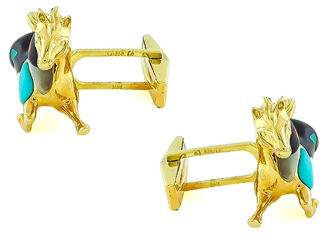 This fabulous pair of 14k yellow gold horse cufflinks by Asch Grossbardt, features mother of pearl, onyx, turquoise, malachite and coral inlay. The gemstones are accentuated by sparkling round cut diamond accents.
The cufflinks are stamped 14K OA/G