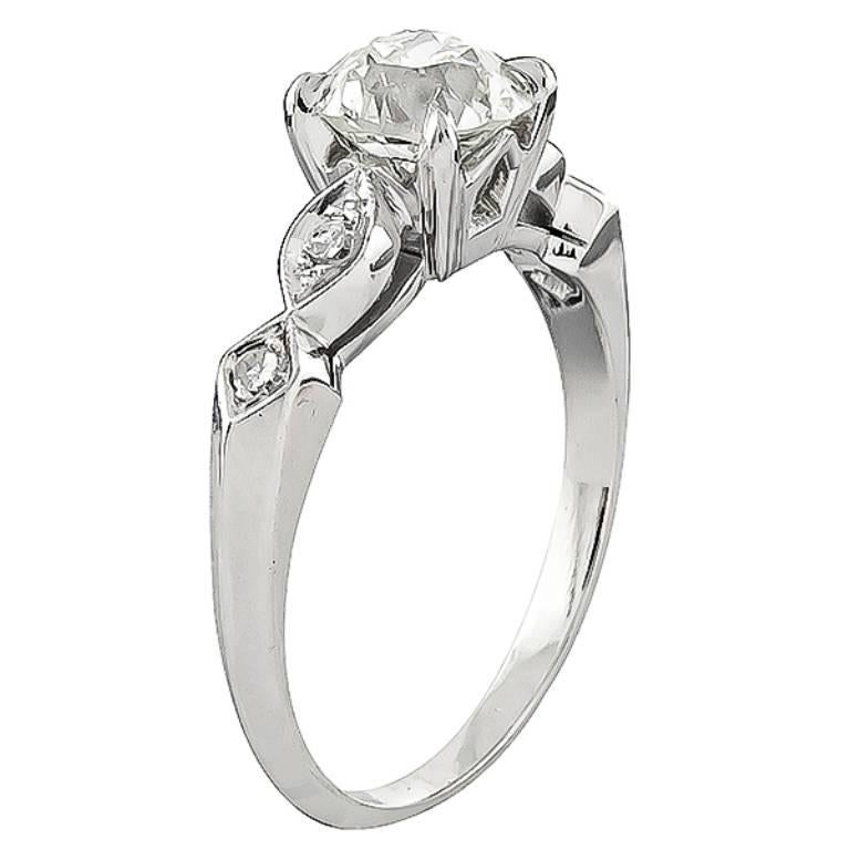 This elegant platinum engagement ring is centered with a sparkling GIA certified old European cut diamond that weighs 1.46ct. graded K color with VS2 clarity. The center diamond is accentuated by dazzling round cut diamond accents.
The ring is