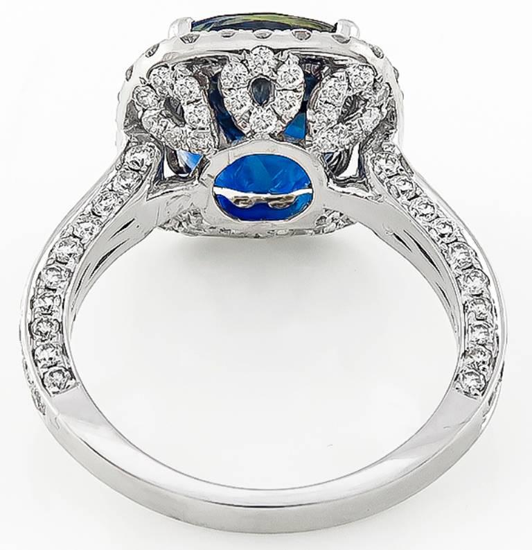 This amazing 18k white gold ring is centered with a stunning sapphire that weighs 6.40ct. Accentuating the sapphire are high quality sparkling round cut diamonds weighing approximately 1.50ct. graded G color with VS clarity. The ring is currently