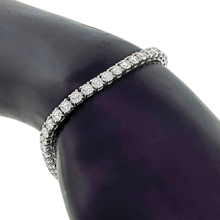 Made of 18k white gold, this stunning classic bracelet featuring high quality sparkling round cut diamonds weighing approximately 12.00ct graded F-H color with VS clarity. This highly flexible line bracelet measures 7 inches in length, 4mm in width