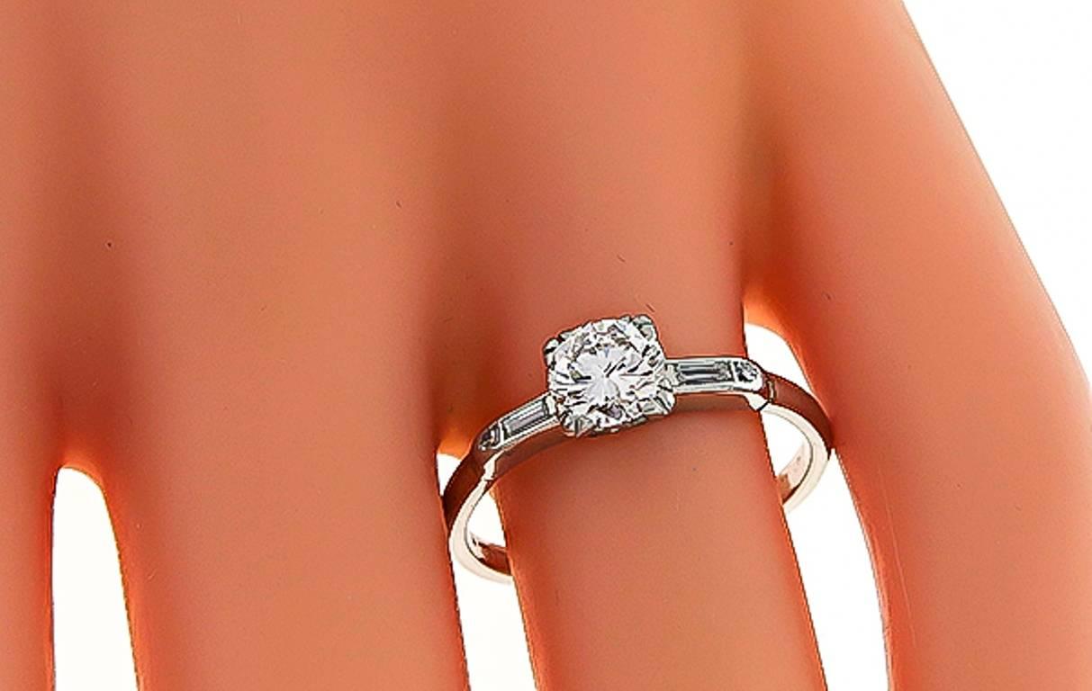 This stunning platinum engagement ring is centered with a sparkling GIA certified round brilliant cut diamond that weighs 0.67ct. graded F color with VS1 clarity. The center diamond is accentuated by dazzling baguette cut diamond accents.
It is