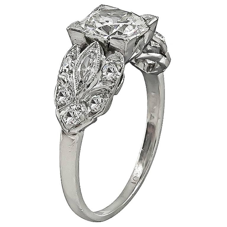 Handcrafted from the Art Deco era, this beautiful ring centers a sparkling GIA certified old mine cut diamond that weighs 1.20ct. graded I color with VVS2 clarity. The center diamond is accentuated by high quality marquise and round cut diamonds