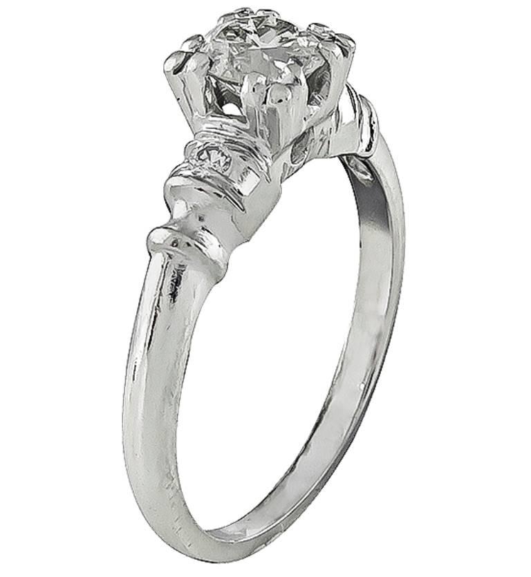 This platinum ring is centered with a sparkling old European cut diamond that weighs approximately 0.55ct. graded I-J color with SI2 clarity. The center diamond is accentuated by dazzling round cut diamond accents.
It is size 6 1/4, and can be