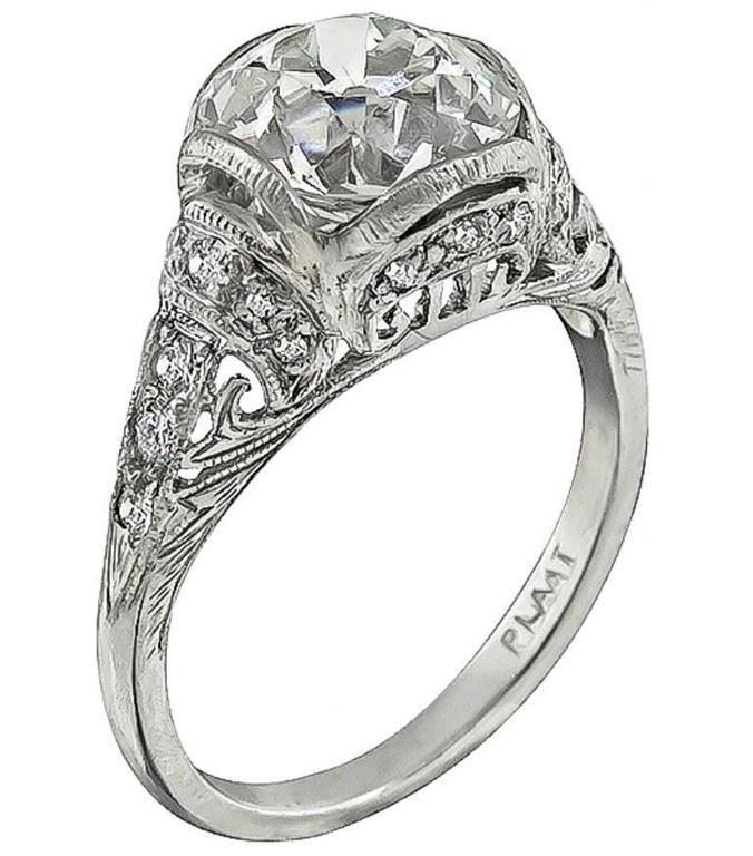 This gorgeous platinum engagement ring is centered with a sparkling GIA certified old European brilliant cut diamond that weighs 2.59ct. graded K color with VVS2 clarity. Accentuating the center stone are high quality diamond accents. The ring is