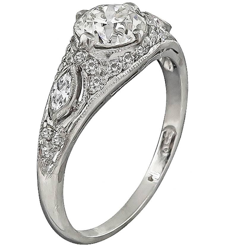 This beautiful platinum ring centers a sparkling GIA certified old European cut diamond that weighs 1.00ct. graded J color with VS1 clarity. The center diamond is accentuated by small old mine and marquise cut diamonds that weigh approximately