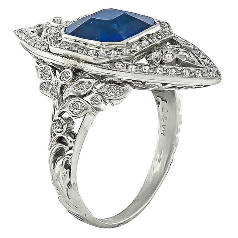 Handcrafted from the Art Deco era, this ring is set with a stunning asscher cut sapphire that weighs 4.39ct. The sapphire is accentuated by sparkling round cut diamonds that weigh approximately 1.00ct. graded H color with VS clarity.
The ring is