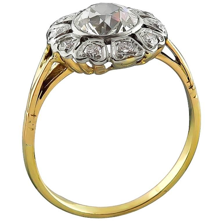 This amazing 14k gold engagement ring from the Victorian era, is centered with a sparkling GIA certified old European cut diamond that weighs 1.31ct. graded K color with VS2 clarity. Accentuating the center stone are dazzling round cut diamonds