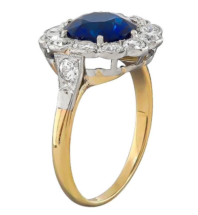 This magnificent 14k gold engagement ring from the Victorian era, is centered with a natural round cut sapphire that weighs 2.80ct. Accentuating the sapphire are sparkling old mine cut diamonds that weigh approximately 1.00ct. graded H color with VS