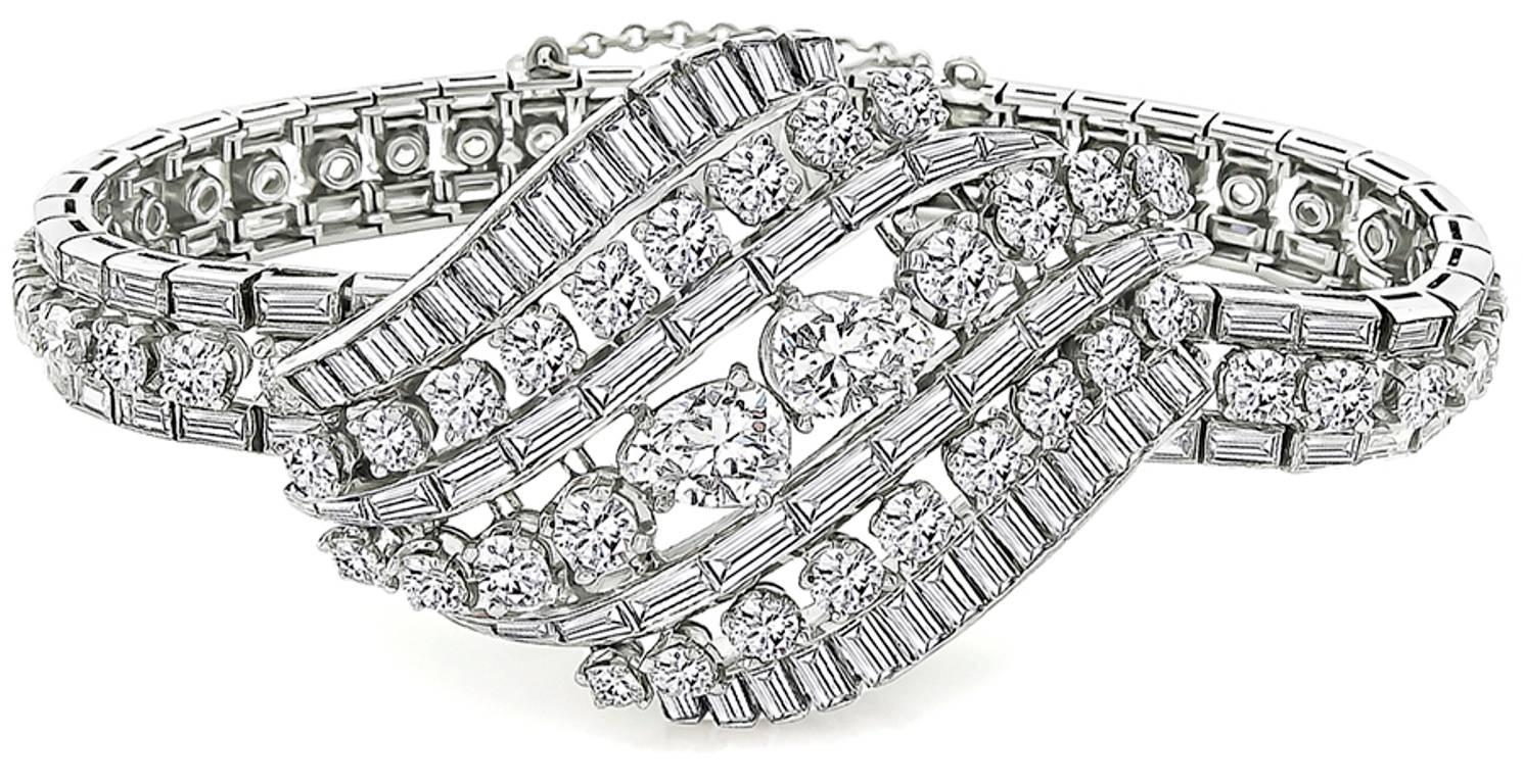 This amazing platinum bracelet from the mid 20th century is set with sparkling pear, round and baguette cut diamonds that weigh approximately 16.00ct. The color of the 2 large pear shape diamonds is H-I with VS1 clarity and the rest of the diamonds