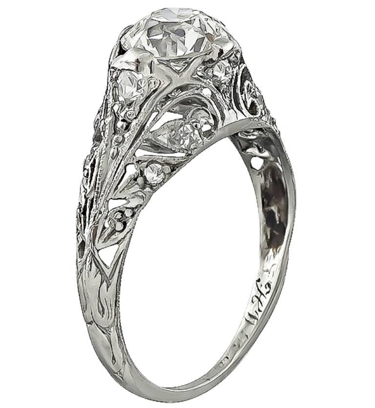 This beautiful platinum ring from the Edwardian era is centered with a sparkling GIA certified old European cut diamond that weighs 1.14ct. graded K color with SI1 clarity. The center diamond is accentuated by dazzling round cut diamond accents. It