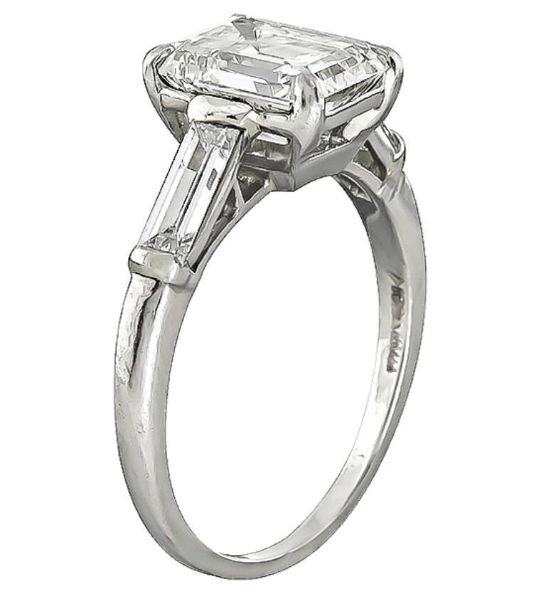 This gorgeous platinum ring is centered with a sparkling EGL certified emerald cut diamond that weighs 1.94ct. graded H color with SI1 clarity. The center diamond is accentuated by dazzling baguette cut diamond accents. The ring is stamped 10% IRID