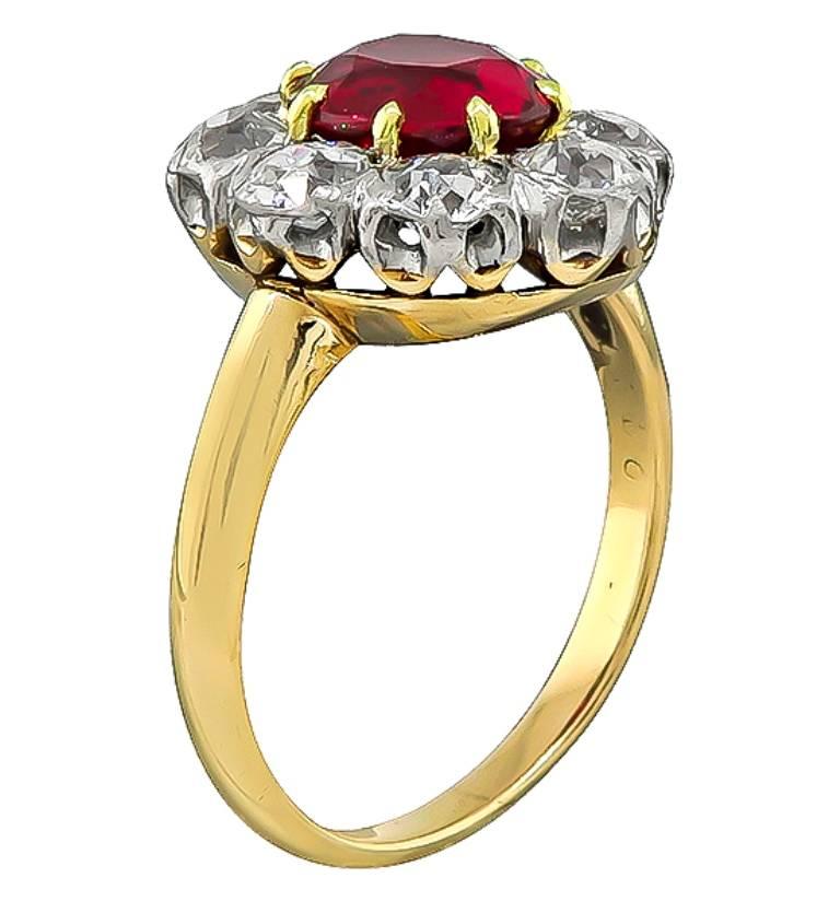 This amazing 14k gold ring centers a stunning AIGS certified natural ruby that weighs 2.07ct with no indication of heating. Accentuating the center stone are sparkling old mine cut diamonds that weigh approximately 1.60ct. graded H-I color with VS2