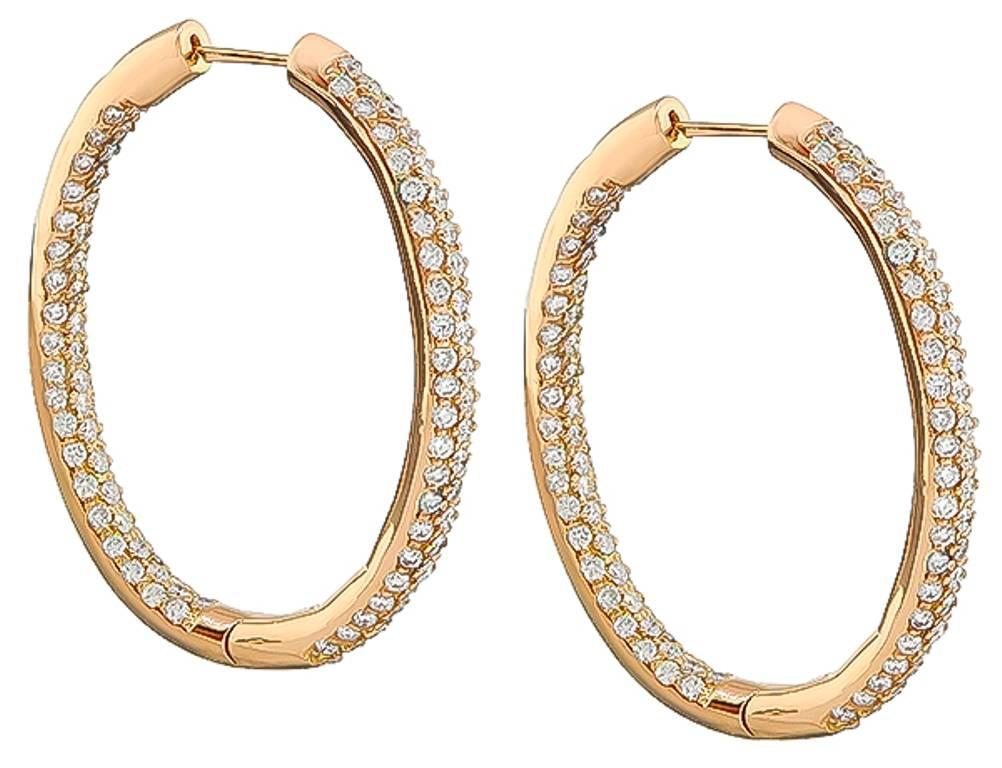 This gorgeous pair of 18k pink gold hoop earrings feature high quality sparkling round cut diamonds that weigh approximately 4.00ct. graded G-H color with VS clarity. The earrings measure 40mm by 4mm and weigh 16.3 grams. 


Inventory #44654ANSS