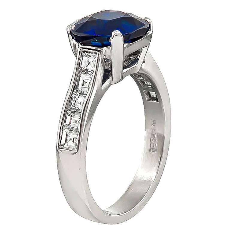 This amazing platinum engagement ring is centered with a lovely cushion cut sapphire that weighs 4.17ct. The sapphire is accentuated by sparkling carre cut diamonds that weigh approximately 0.75ct. graded F color with VS1 clarity.
The ring is size 7